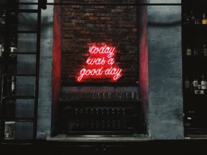 Red neon sign says 'Today was a good day'