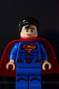 Lego superhero in blue outfit with red cape