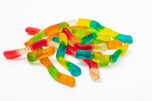 A heap of colourful sour worm lollies